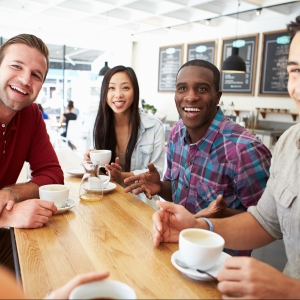 Group Of Friends Meeting In Coffee Shop